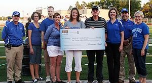 Wayne High athletic director Rocky Ruhl (left), Jodi Pulfer, Ryan Hix, Laura Gamble (members of the Wayne Community Schools Foundation), Lindsay McLaughlin (Foundation Director), Jim Erwin, Monsanto representative, Lee Brogie (who will oversee the use of grant money), Mark Lenihan (Wayne Community Schools Superintendent) and Terri Hypse (member of the Foundation). (Photo by Clara Osten)